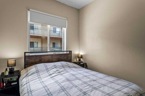 211-176 Kananaskis Way, Canmore, AB - Indoor Photo Showing Bedroom