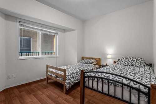 211-176 Kananaskis Way, Canmore, AB - Indoor Photo Showing Bedroom