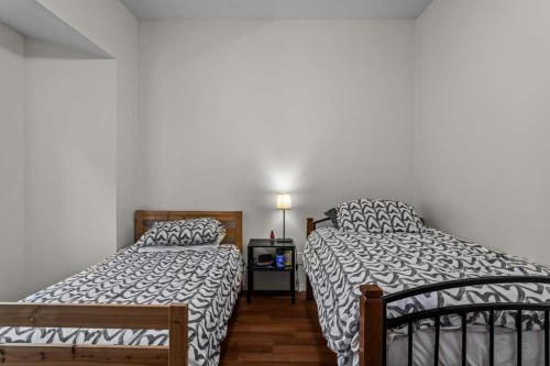 211-176 Kananaskis Way, Canmore, AB - Indoor Photo Showing Bedroom