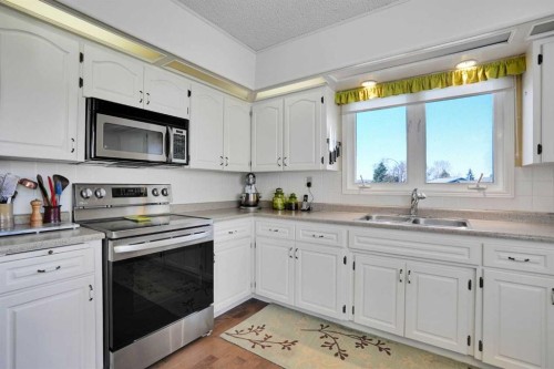 228 Dovercrest Place Se, Calgary, AB - Indoor Photo Showing Kitchen With Double Sink