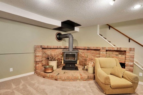 228 Dovercrest Place Se, Calgary, AB - Indoor Photo Showing Other Room With Fireplace