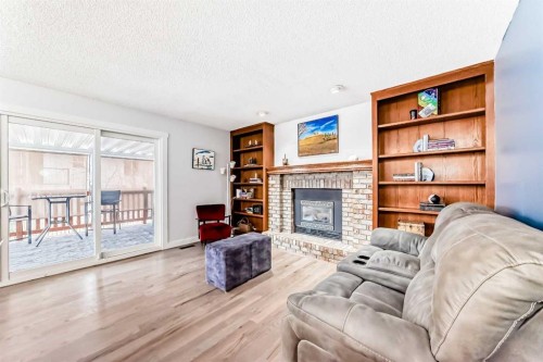 7 Sunset Crescent, Okotoks, AB - Indoor Photo Showing Living Room With Fireplace