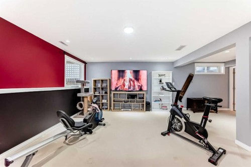 7 Sunset Crescent, Okotoks, AB - Indoor Photo Showing Gym Room