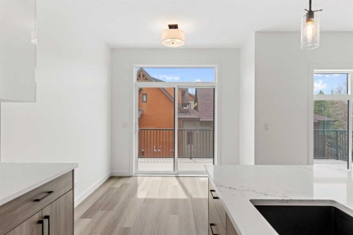 134-2231 81 Street Sw, Calgary, AB - Indoor Photo Showing Kitchen With Double Sink