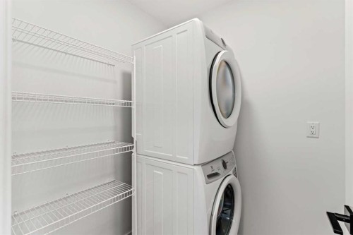 134-2231 81 Street Sw, Calgary, AB - Indoor Photo Showing Laundry Room