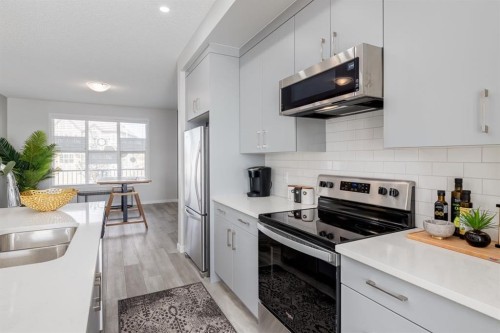 44 Tillotson Loop, Okotoks, AB - Indoor Photo Showing Kitchen With Stainless Steel Kitchen With Double Sink With Upgraded Kitchen