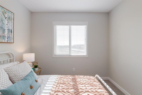 44 Tillotson Loop, Okotoks, AB - Indoor Photo Showing Bedroom