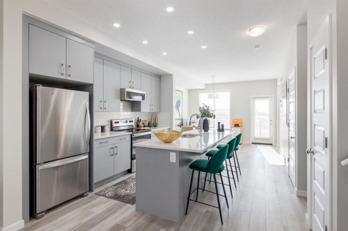 44 Tillotson Loop, Okotoks, AB - Indoor Photo Showing Kitchen With Stainless Steel Kitchen With Upgraded Kitchen
