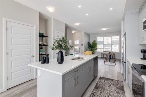 44 Tillotson Loop, Okotoks, AB - Indoor Photo Showing Kitchen With Double Sink