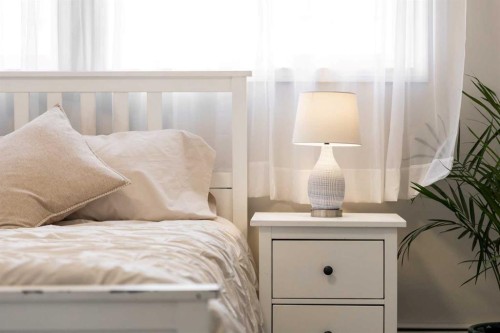 215-101 Big Hill Way Se, Airdrie, AB - Indoor Photo Showing Bedroom