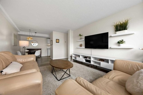 215-101 Big Hill Way Se, Airdrie, AB - Indoor Photo Showing Living Room