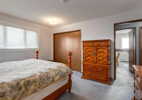 223 Cedarwood Road Sw, Calgary, AB - Indoor Photo Showing Bedroom
