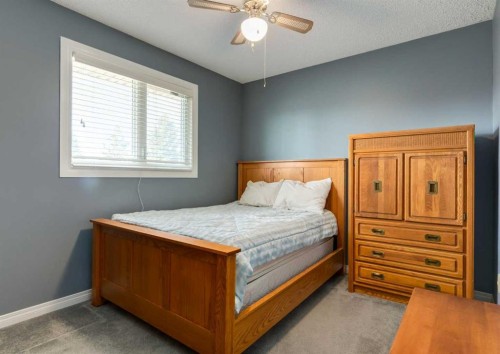 223 Cedarwood Road Sw, Calgary, AB - Indoor Photo Showing Bedroom