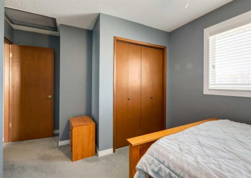 223 Cedarwood Road Sw, Calgary, AB - Indoor Photo Showing Bedroom