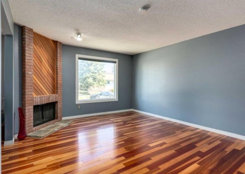 223 Cedarwood Road Sw, Calgary, AB - Indoor With Fireplace