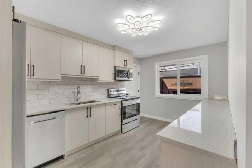 853 Northmount Drive Nw, Calgary, AB - Indoor Photo Showing Kitchen With Double Sink