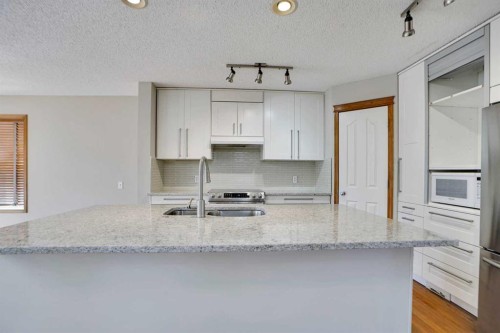 50 Cranfield Crescent Se, Calgary, AB - Indoor Photo Showing Kitchen With Double Sink
