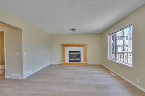 6 Somerset Close Sw, Calgary, AB - Indoor Photo Showing Living Room With Fireplace