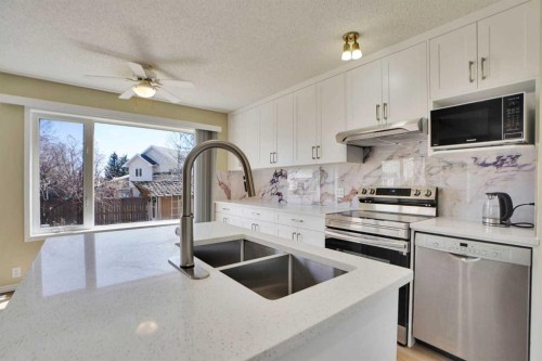 6 Somerset Close Sw, Calgary, AB - Indoor Photo Showing Kitchen With Double Sink