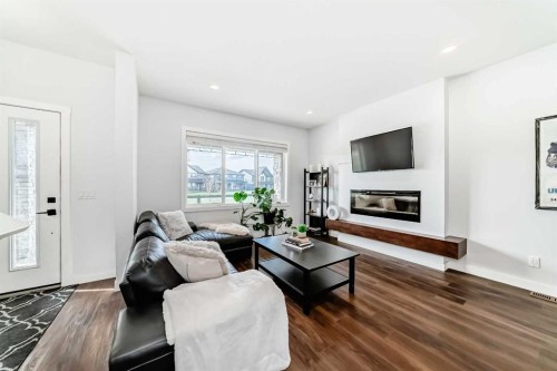 29 Midgrove Lane Sw, Airdrie, AB - Indoor Photo Showing Living Room With Fireplace