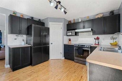 529 Railway Avenue, Langdon, AB - Indoor Photo Showing Kitchen With Double Sink