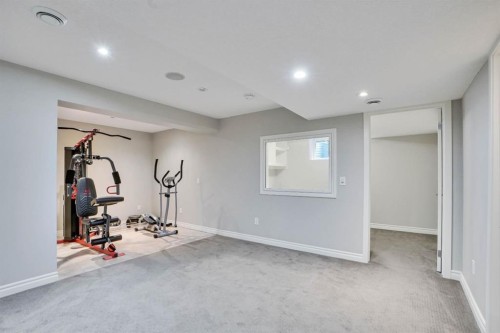 117 Hawkmere Place, Chestermere, AB - Indoor Photo Showing Gym Room