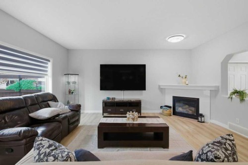129 Cranfield Green Se, Calgary, AB - Indoor Photo Showing Living Room With Fireplace