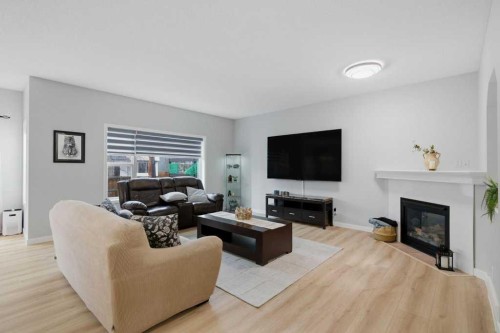 129 Cranfield Green Se, Calgary, AB - Indoor Photo Showing Living Room With Fireplace