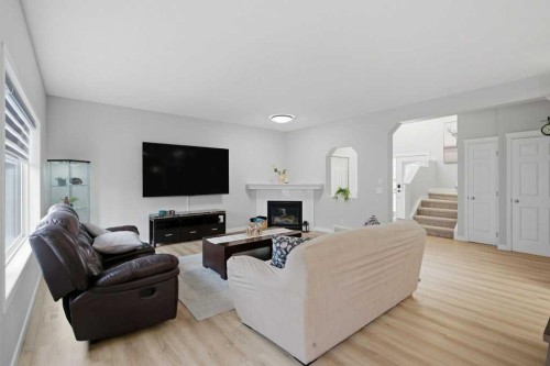 129 Cranfield Green Se, Calgary, AB - Indoor Photo Showing Living Room With Fireplace