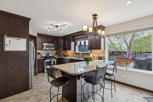 48 Westridge Drive, Okotoks, AB - Indoor Photo Showing Kitchen With Upgraded Kitchen