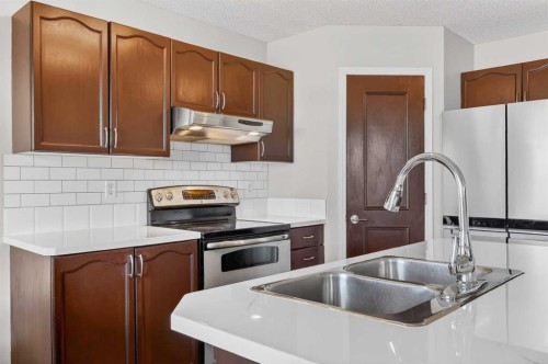 112 Chaparral Circle Se, Calgary, AB - Indoor Photo Showing Kitchen With Stainless Steel Kitchen With Double Sink