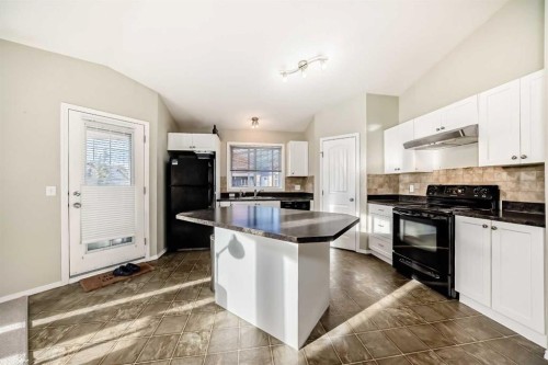 205-20 Panatella Landing Nw, Calgary, AB - Indoor Photo Showing Kitchen With Double Sink