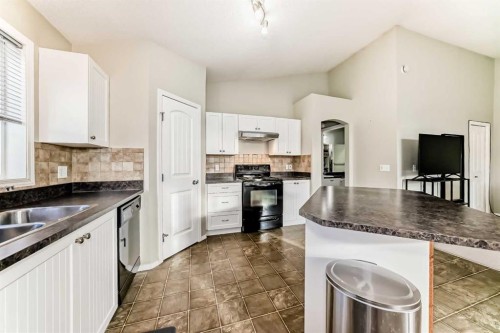 205-20 Panatella Landing Nw, Calgary, AB - Indoor Photo Showing Kitchen With Double Sink