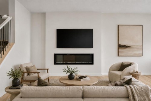 675 Buffaloberry Manor Se, Calgary, AB - Indoor Photo Showing Living Room With Fireplace