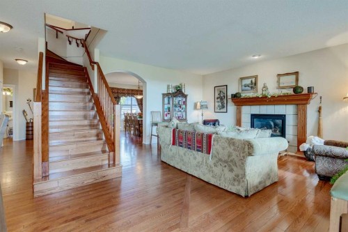40 Springbank Bay Sw, Calgary, AB - Indoor Photo Showing Living Room With Fireplace