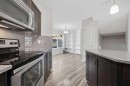 93 Sunvalley Road, Cochrane, AB  - Indoor Photo Showing Kitchen With Upgraded Kitchen 