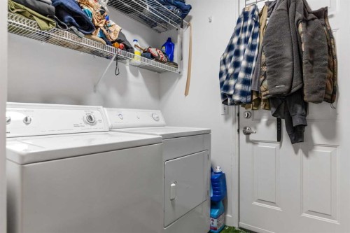 100 Saddlecrest Boulevard Ne, Calgary, AB - Indoor Photo Showing Laundry Room