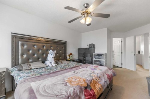 100 Saddlecrest Boulevard Ne, Calgary, AB - Indoor Photo Showing Bedroom