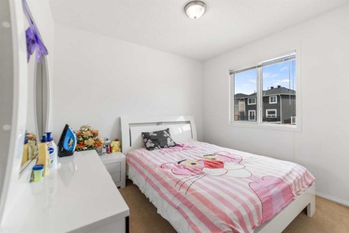 100 Saddlecrest Boulevard Ne, Calgary, AB - Indoor Photo Showing Bedroom