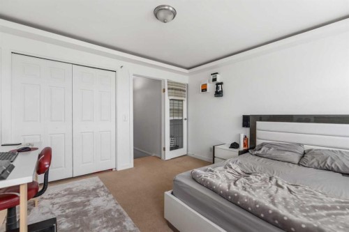 100 Saddlecrest Boulevard Ne, Calgary, AB - Indoor Photo Showing Bedroom