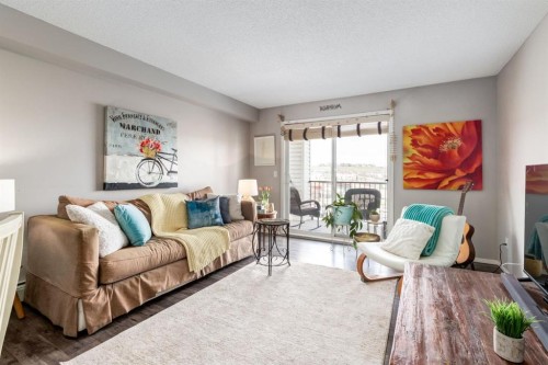 1414-12 Cimarron Common, Okotoks, AB - Indoor Photo Showing Living Room With Fireplace
