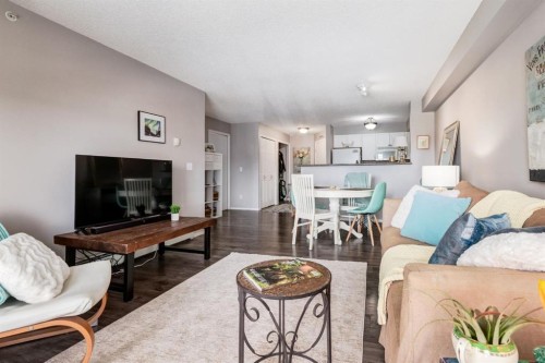 1414-12 Cimarron Common, Okotoks, AB - Indoor Photo Showing Living Room