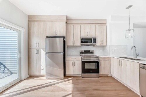 21 Cornergate Place Ne, Calgary, AB - Indoor Photo Showing Kitchen With Upgraded Kitchen
