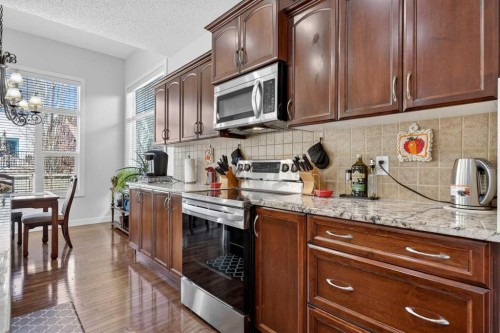 64 Cranridge Crescent Se, Calgary, AB - Indoor Photo Showing Kitchen With Stainless Steel Kitchen