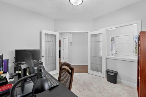 64 Cranridge Crescent Se, Calgary, AB - Indoor Photo Showing Living Room With Fireplace