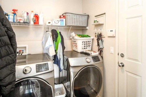 4 Springbank Bay Sw, Calgary, AB - Indoor Photo Showing Laundry Room