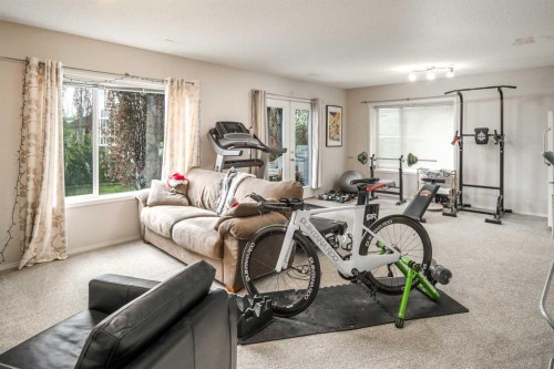 4 Springbank Bay Sw, Calgary, AB - Indoor Photo Showing Gym Room