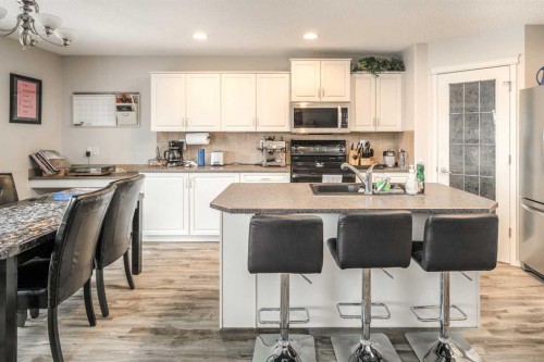 4 Springbank Bay Sw, Calgary, AB - Indoor Photo Showing Kitchen With Stainless Steel Kitchen With Double Sink