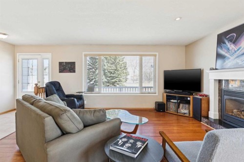8523 Addison Place Se, Calgary, AB - Indoor Photo Showing Living Room With Fireplace