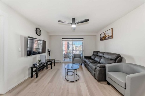 1312-755 Copperpond Boulevard Se, Calgary, AB - Indoor Photo Showing Living Room